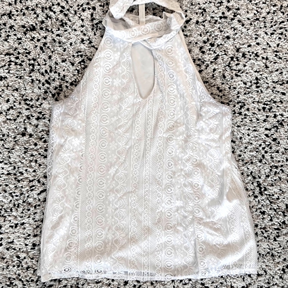White sleeveless tie-neck blouse